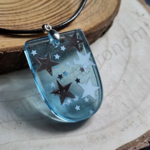 Epoxy Resin Pendant - Shield-Shaped Transparent Blue with Black & White Stars