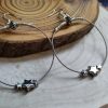 Silver guitar string earrings with silver star beads